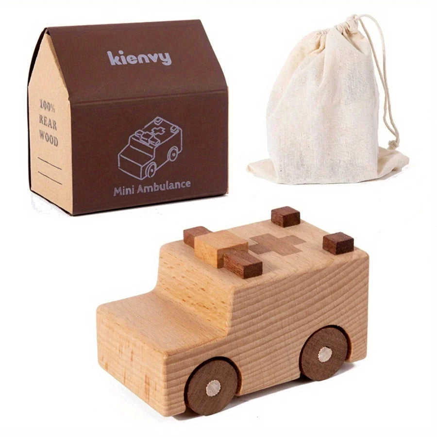 Une boîte en carton marron étiquetée Kienvy Mini Ambulance et un véhicule ambulance en bois jouet.