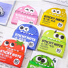 A collection of colorful sticky notes in various shapes and colors, including pink, yellow, blue, and green, packaged for sal