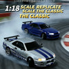 A 1:18 scale replica of a classic drift car, featuring a blue and silver sports car in motion.