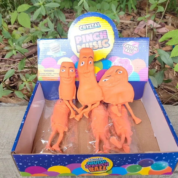 A box of Crystal Pinch Music and Crystal Ball toys featuring orange sensory decompression toys.
