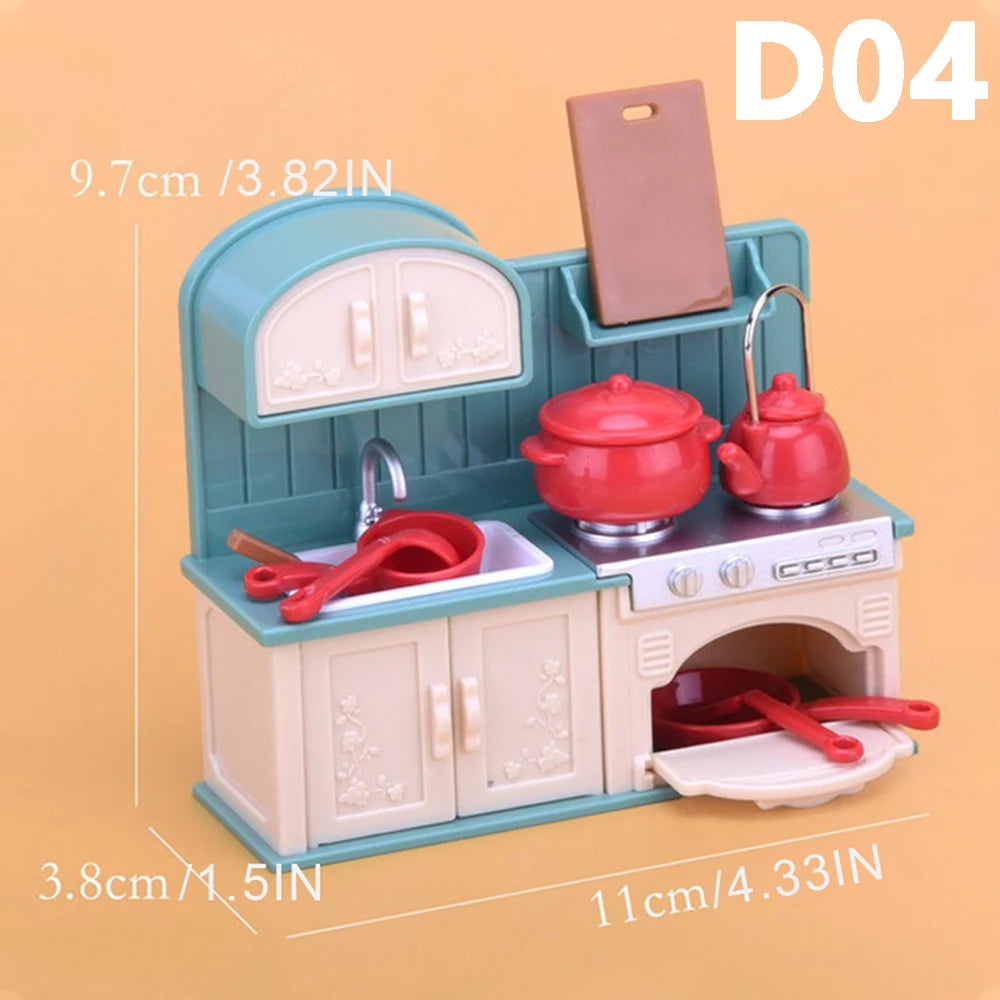 A miniature dollhouse kitchen set featuring a sink, stove, and various accessories in light blue and pink tones.