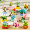 A collection of colorful DIY flower succulent building blocks and desktop plant decor in various pots.