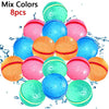 A collection of eight colorful, reusable water balloons in shades of pink, blue, and orange.