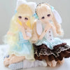 A pair of Guardian Xiangxiang collectible figures, one blonde and one light brown, in a blind box packaging.