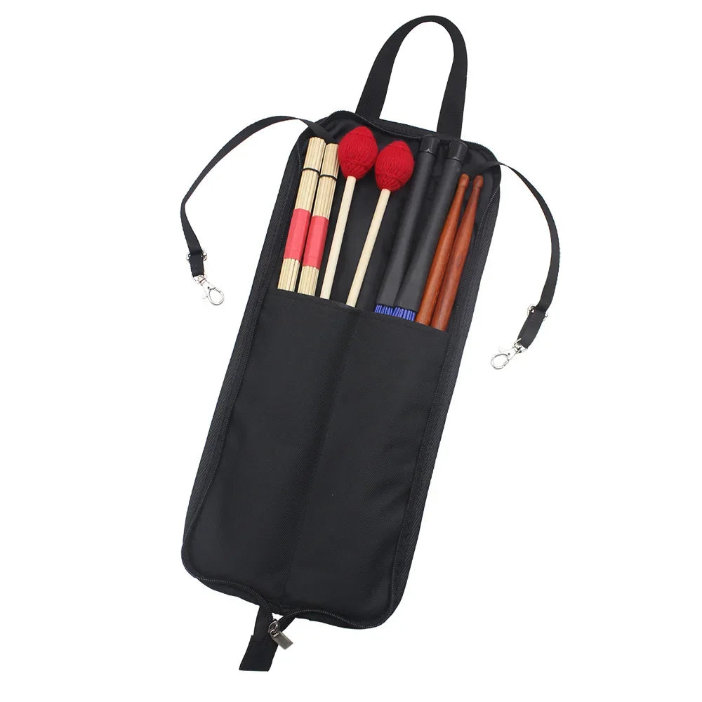 Black water-resistant drumstick carrier bag with a handle and various drumsticks inside