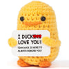 Handmade crochet sunflower pot doll in yellow with a red heart detail