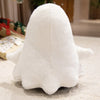 A white ghost plush toy with a rounded body and small arms is resting on a light-colored surface.
