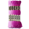 A set of six skeins of vibrant pink and purple embroidery thread for cross stitch and DIY crafts