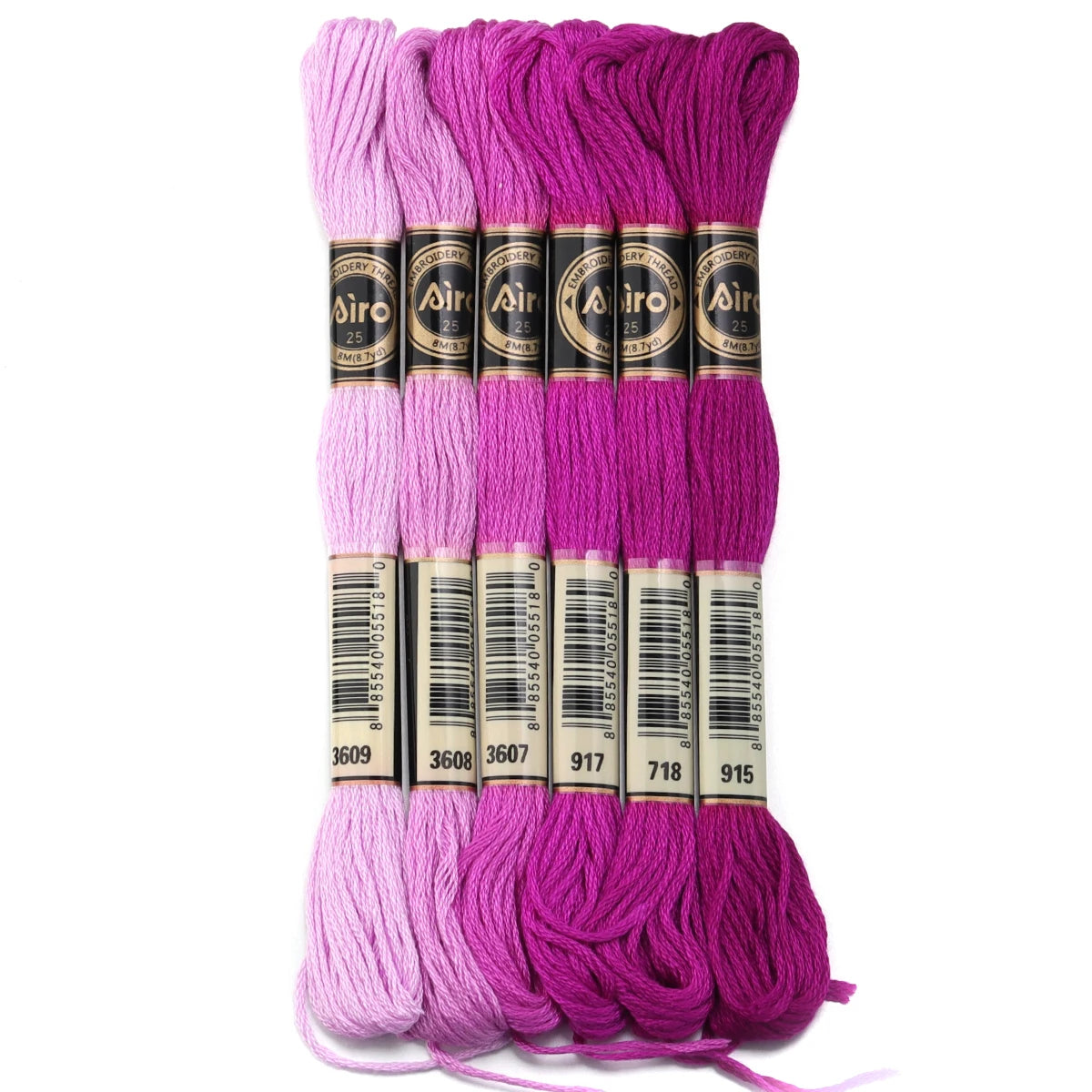 A set of six skeins of vibrant pink and purple embroidery thread for cross stitch and DIY crafts