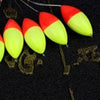 A row of bright red and yellow oval fishing floats with bobber beads are shown against a dark background.