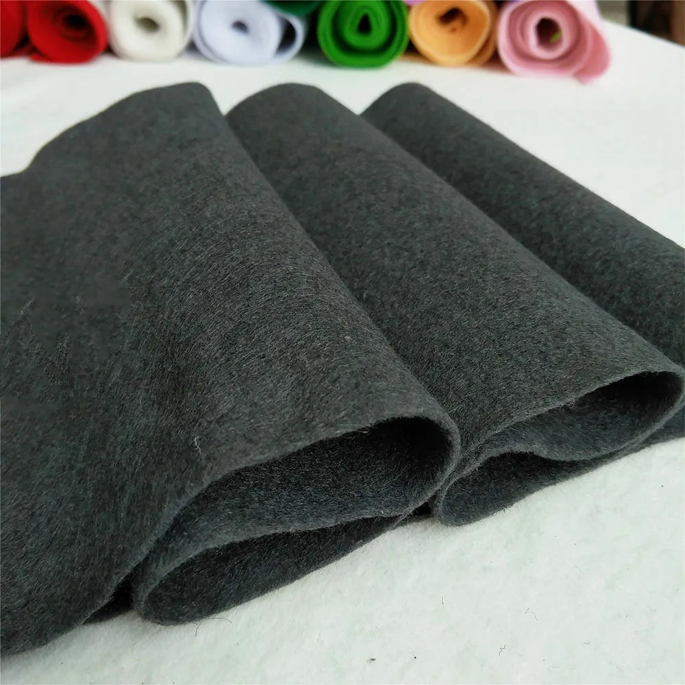 Rolls of dark gray felt fabric sheets for DIY crafts and sewing projects