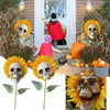 A set of skull sunflower garden decorations featuring skulls mounted on bright yellow sunflowers.