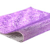 Purple sparkling rhinestone adhesive tape rolled up for DIY crafts and decor
