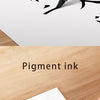 A close-up of a black pen writing Chinese calligraphy on white paper, demonstrating the soft and elegant tip of the brush pen