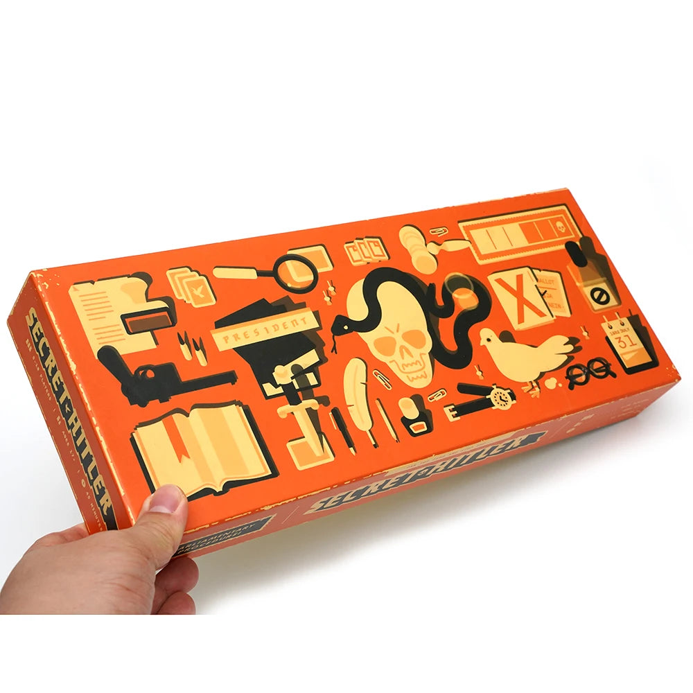 An orange box for the Secret Hitle social deduction card game featuring various icons and text.