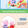 A pink piggy ride-on toy car with a pink pig figure is shown in a bright outdoor setting.