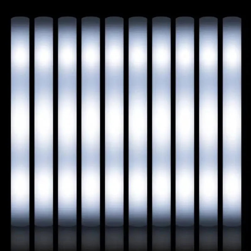 A row of bright, vertical LED glow sticks with a soft blue light illuminating a dark surface.