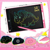 A pink LCD writing tablet with a dinosaur drawing on the screen and accessories like a stylus and key.