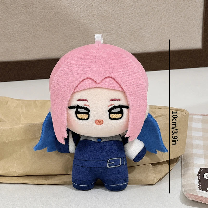A plush keychain set featuring a character with pink hair and blue wings, packaged in brown paper.