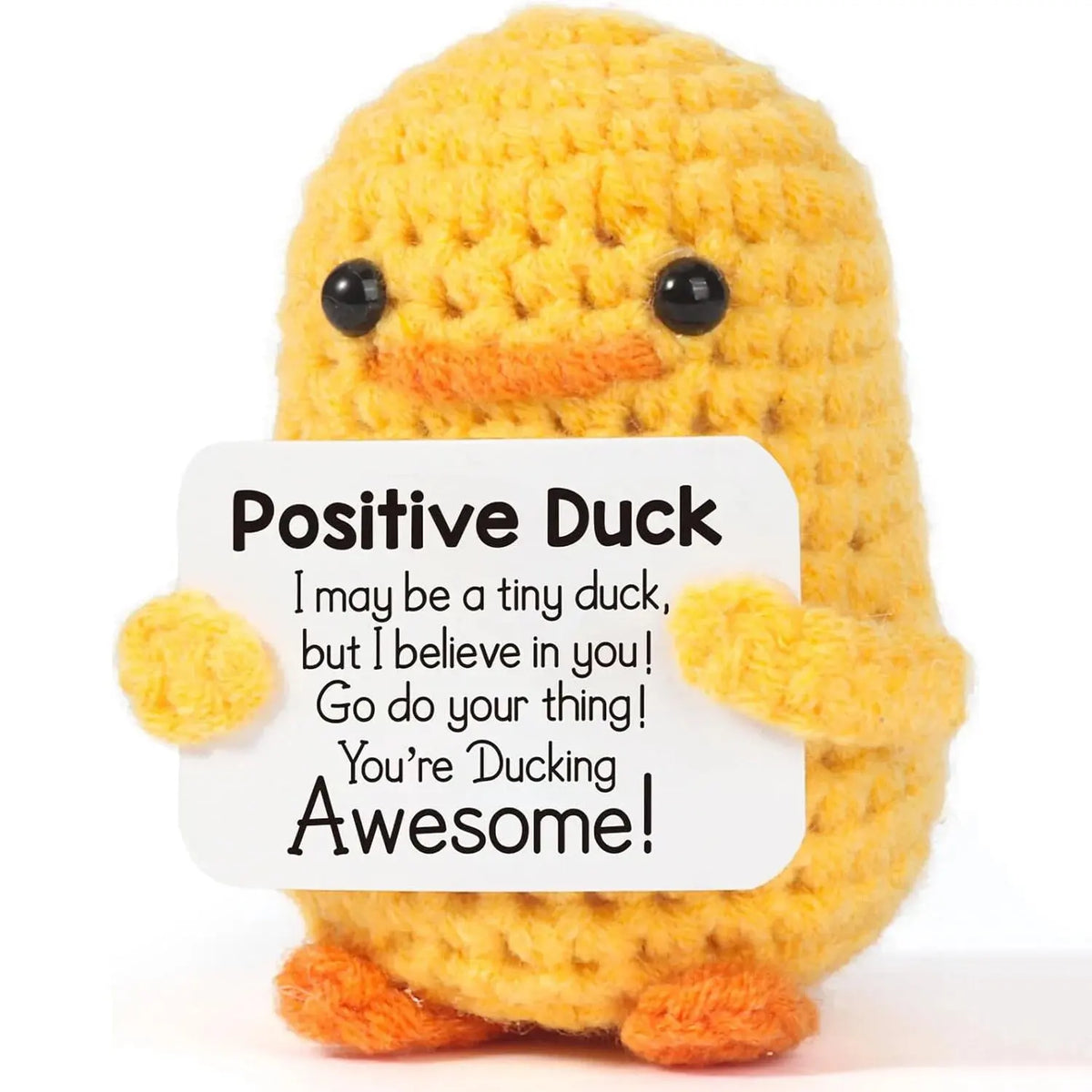 A handmade crochet positive duck doll in yellow with orange accents.