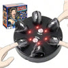 A hand is operating an electric shock party game called Six-Finger Roulette Challenge, which features a black disc with elect