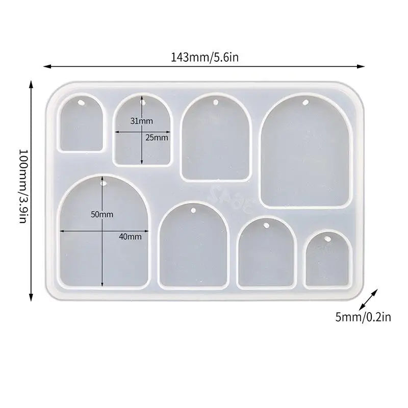 A white silicone mold set with six geometric shapes for making epoxy resin earrings and pendants.