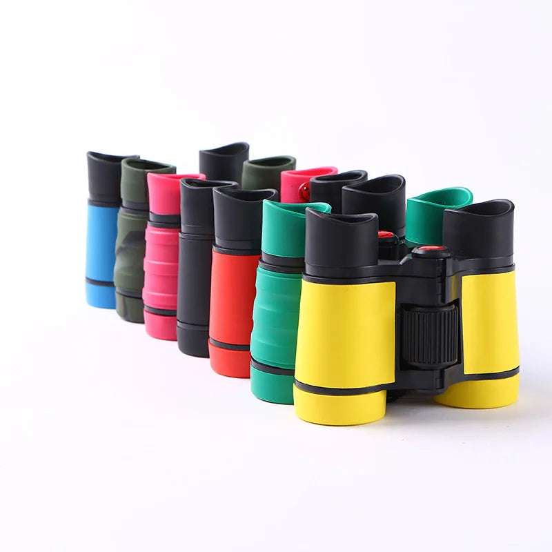 A row of colorful kids binoculars in various colors like blue, green, pink, and red.