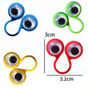 A collection of colorful silicone eye rings used as sensory fidget toys or party favors.