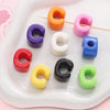 A collection of colorful acrylic letter beads in various shades like orange, purple, pink, white, blue, red, yellow, and blac