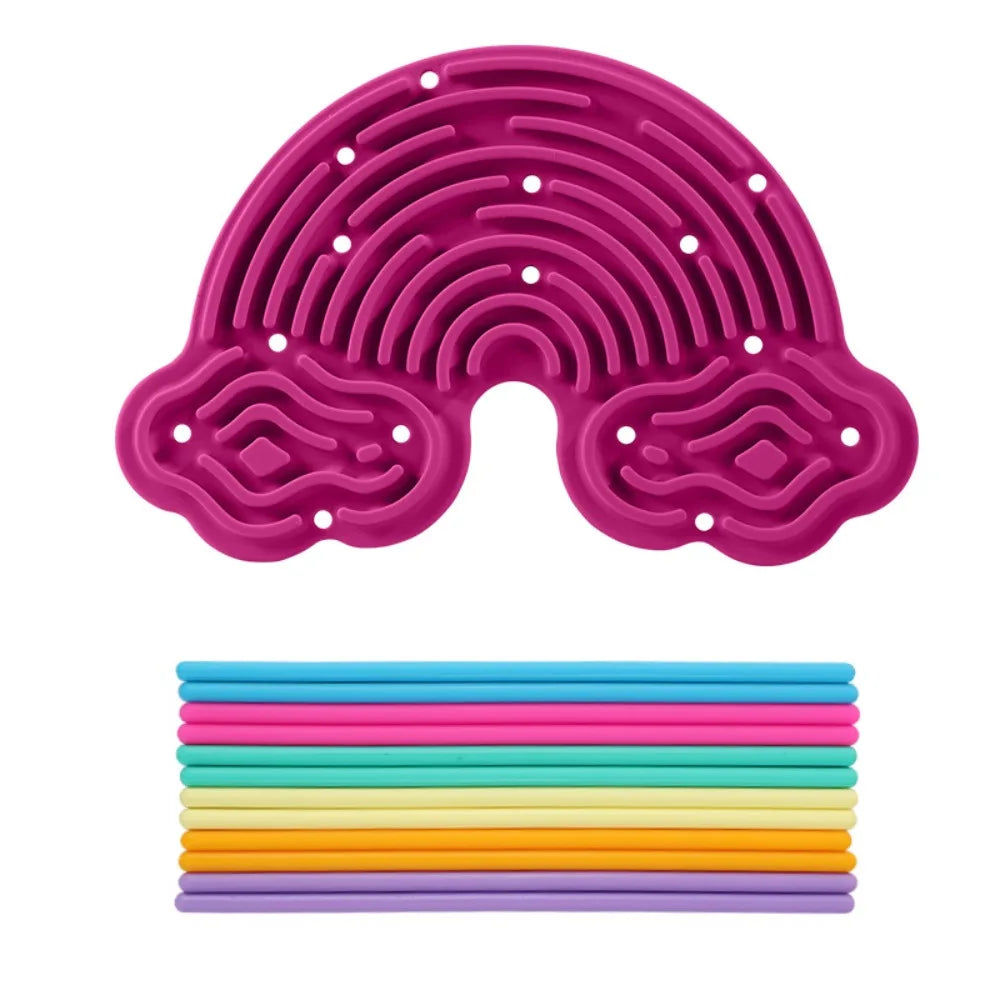A pink silicone sensory activity board with 12 colorful strings laid out below it.