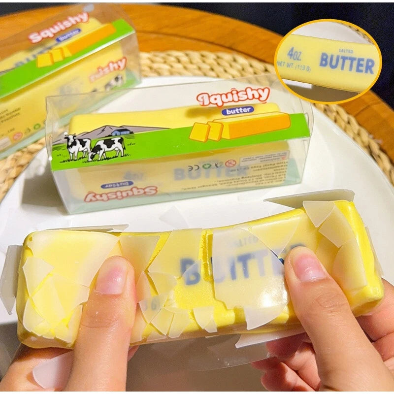 Hands hold a yellow squishy butter fidget ball next to its packaging and an informational circle.