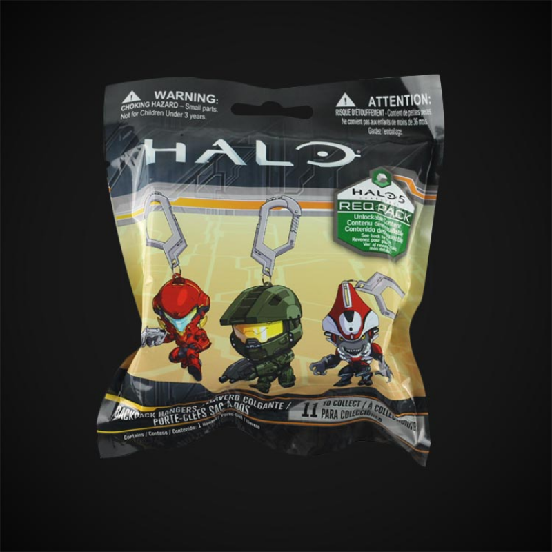 A sealed plastic bag containing Halo themed Master Chief keychain pendants and collectible game figures.
