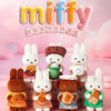 A collection of Miffy plush toys in various colors and outfits, including a bear, bunny, and other characters.