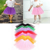 A collection of sparkling princess tutus in various colors including purple, pink, green, red, and yellow.