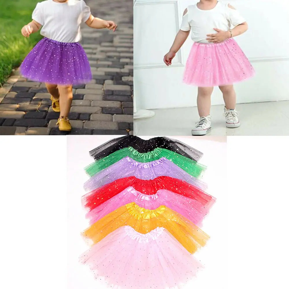 A collection of sparkling princess tutus in various colors including purple, pink, green, red, and yellow.