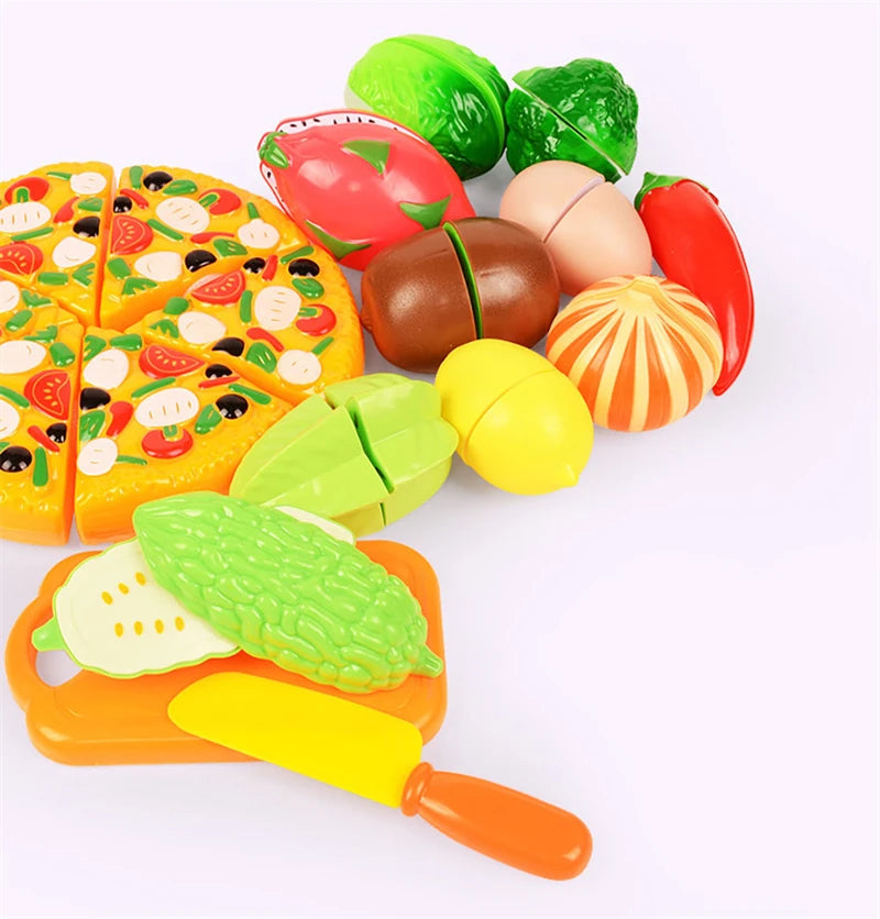 A colorful pretend play kitchen set featuring various plastic fruits and vegetables like apples, tomatoes, and peppers.