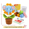 A finished blue elephant crochet toy with orange ears and a set of crochet tools and yarn is displayed.