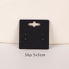 A black square jewelry display card with a cutout and two slots is shown on a white background.