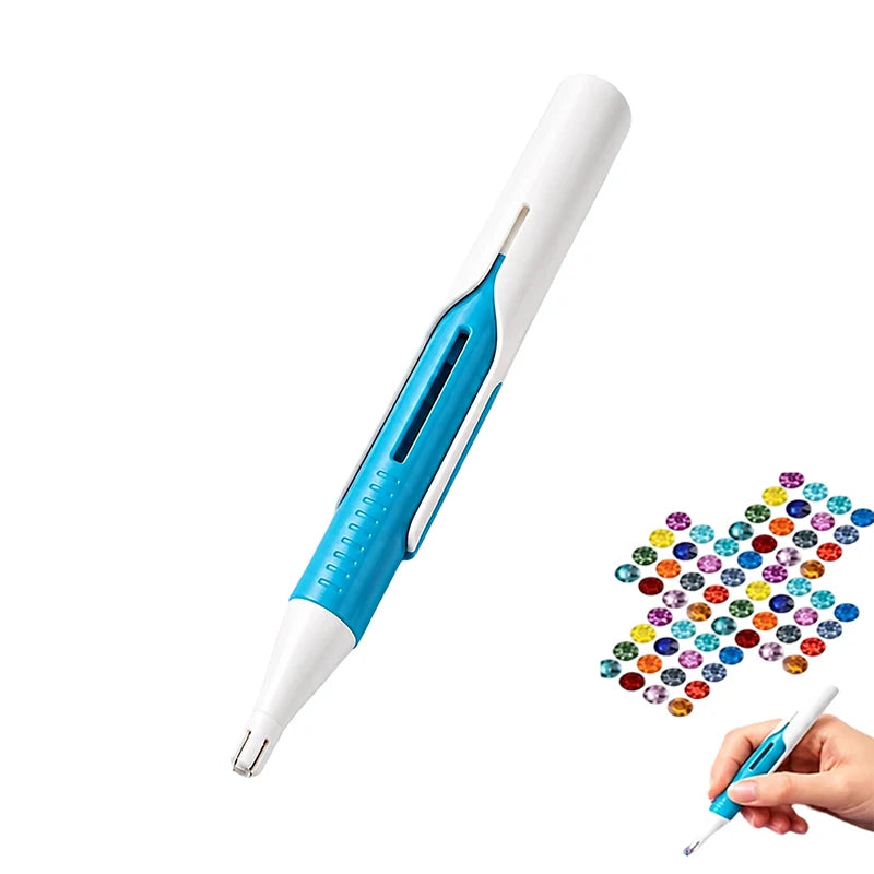 A white and blue diamond painting pen with an automatic bead dispenser is shown next to a hand holding the tip.