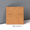 A square kraft cardboard jewelry display card with two small circular holes on the front.