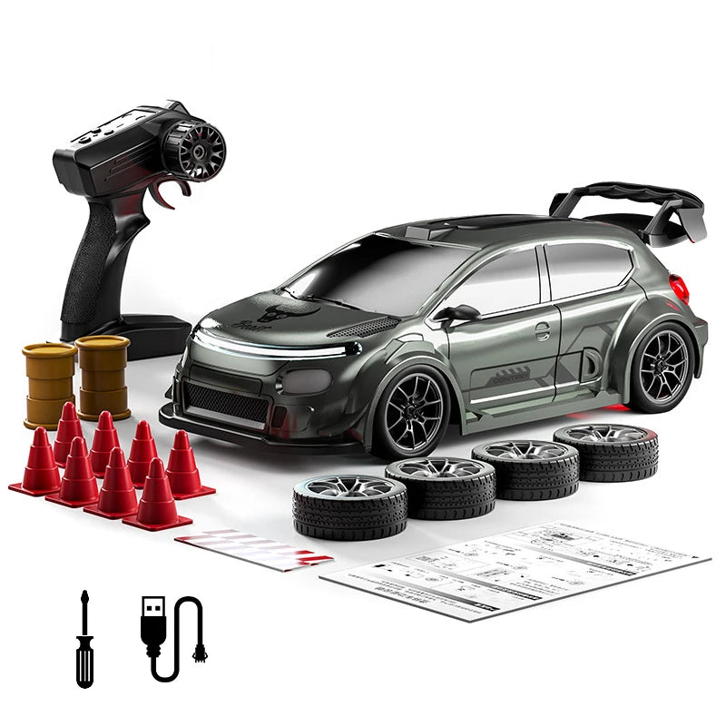 A black RC drift car with LED lights and an adjustable speed controller is shown next to tires and tools.