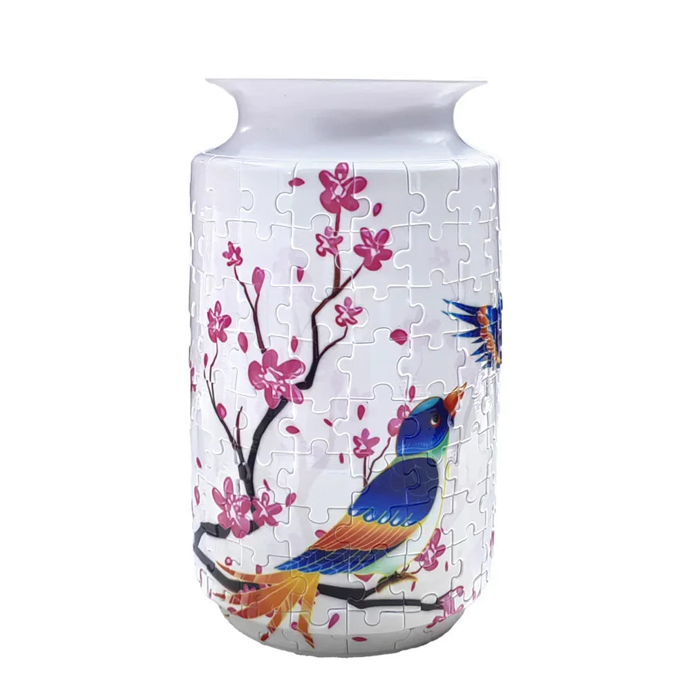 A white porcelain flower vase puzzle featuring pink blossoms and a blue bird.