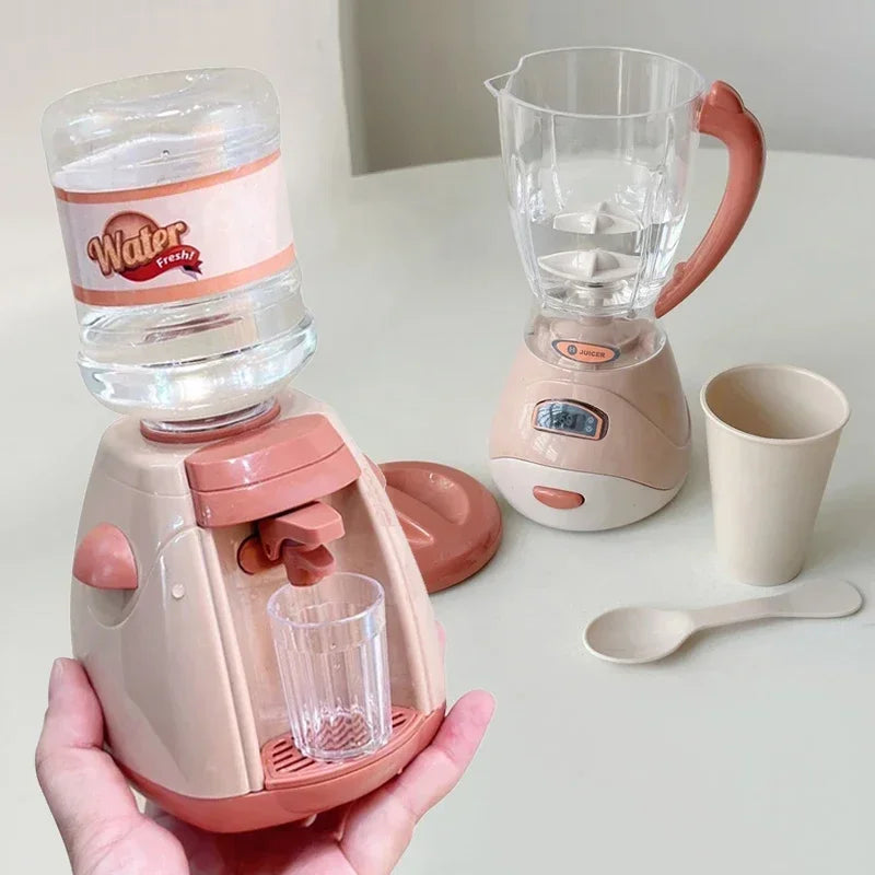 A pink kids pretend play kitchen set featuring a coffee maker, water dispenser, and toaster on a white table.
