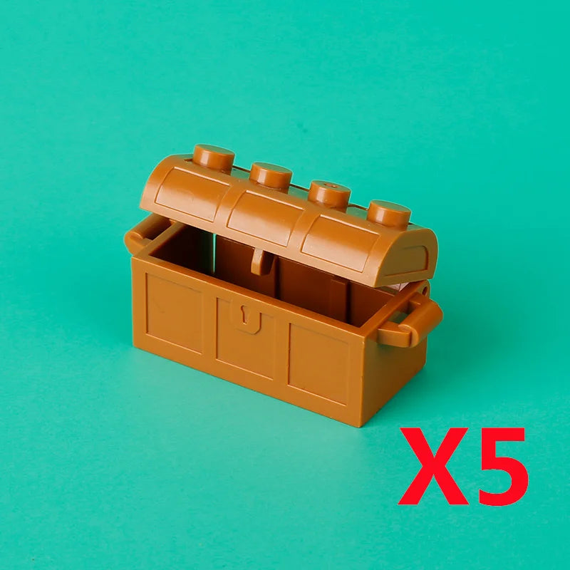 A wooden treasure chest building block set with a hinged lid and coins, shown against a teal background.