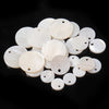 A collection of natural white shell beads in various rondelle round sizes.