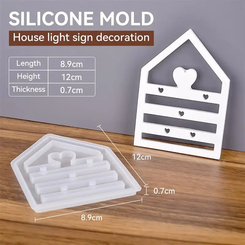 A white silicone mold set for house light sign decoration showing various shapes and dimensions.