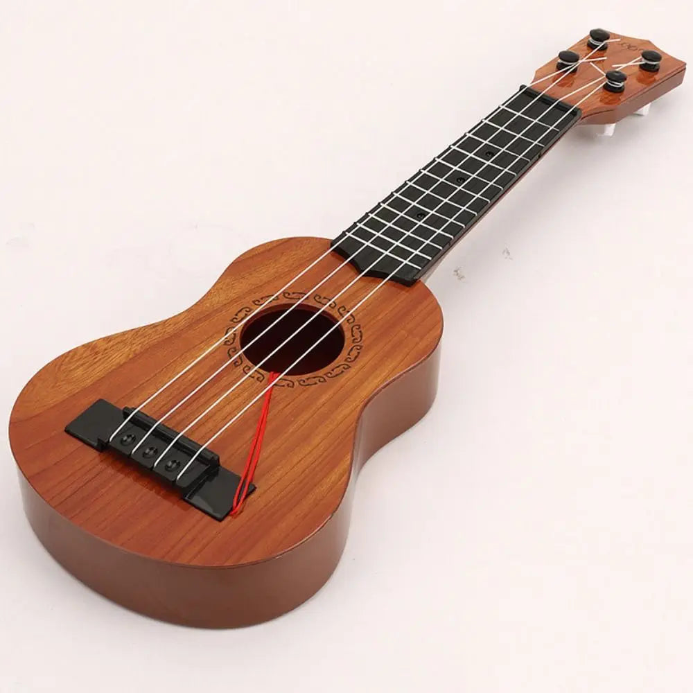 A wooden ukulele toy with adjustable tuning pegs and a red string, shown from above.
