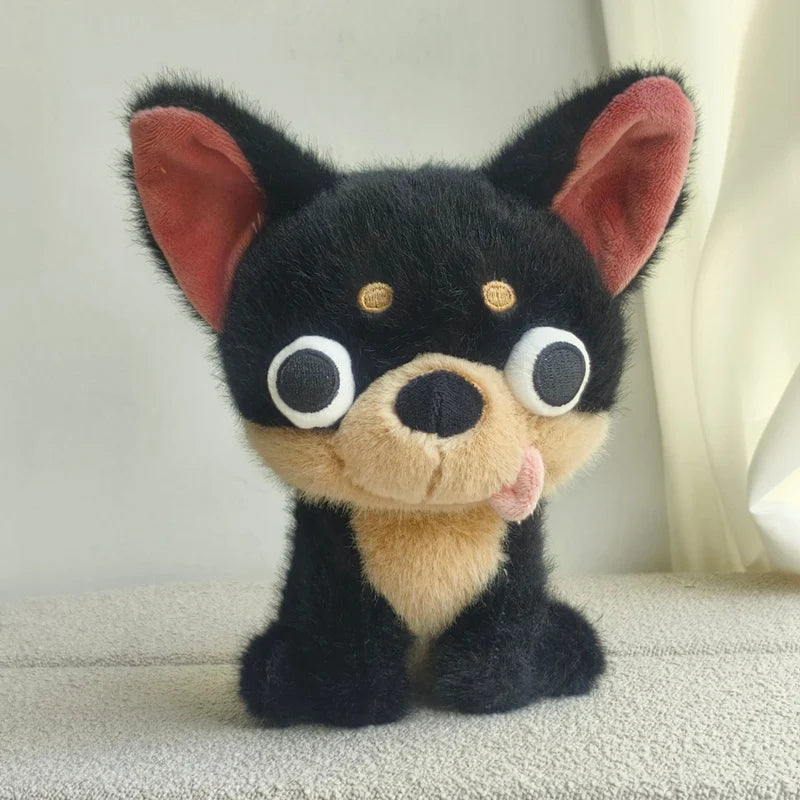 A black Chihuahua plush doll with large eyes and a pink tongue sticking out.