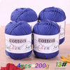 Four skeins of blue cotton knitting yarn for crochet and handmade projects