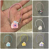 A collection of mini plush camera doll accessories in various colors and styles for a 17cm Labubu figure.